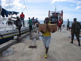 Image #35 - Hurricane Tomas Relief Effort (Carrying the goods to the distribution point)